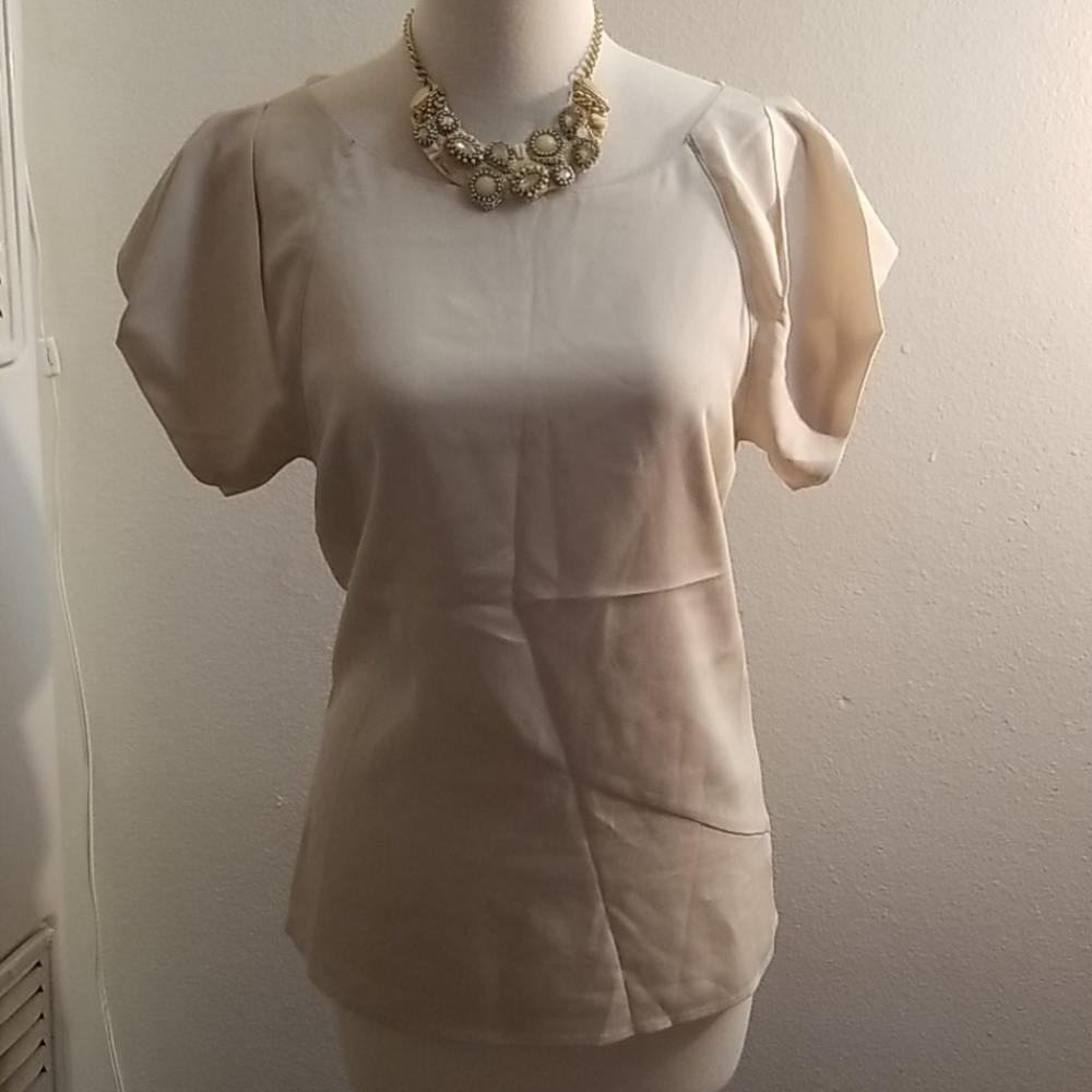 A naked zebra low back blouse size M